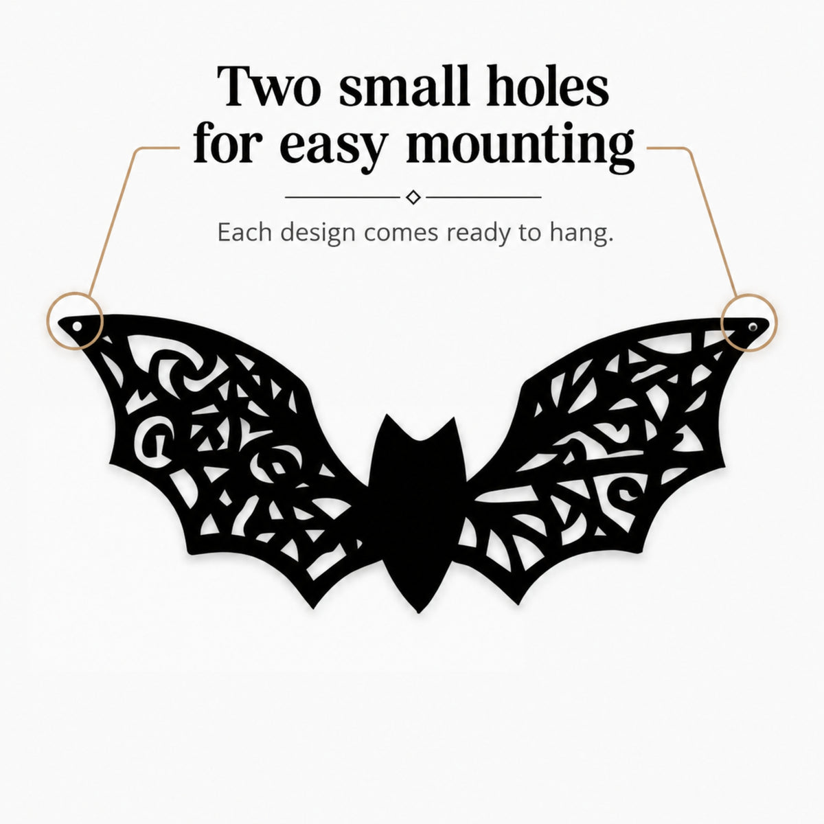 Black bat-shaped wall hanging with intricate cutout wing patterns, shown on a light gray background with text reading 'Two small holes for easy mounting' and 'Each design comes ready to hang.'.
