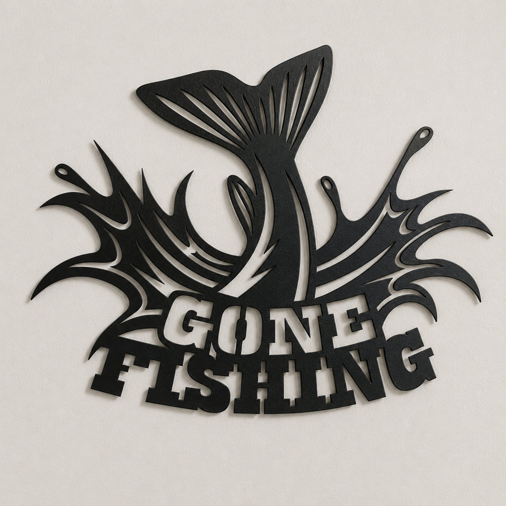 A black metal wall art piece featuring a jumping fish silhouette and the words 'GONE FISHING' in bold lettering, mounted on a light beige wall.
