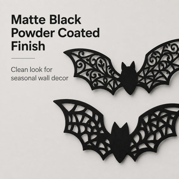 Two black bat-shaped wall decorations with intricate cutout wing patterns, shown on a light gray background with text describing a matte black powder-coated finish.