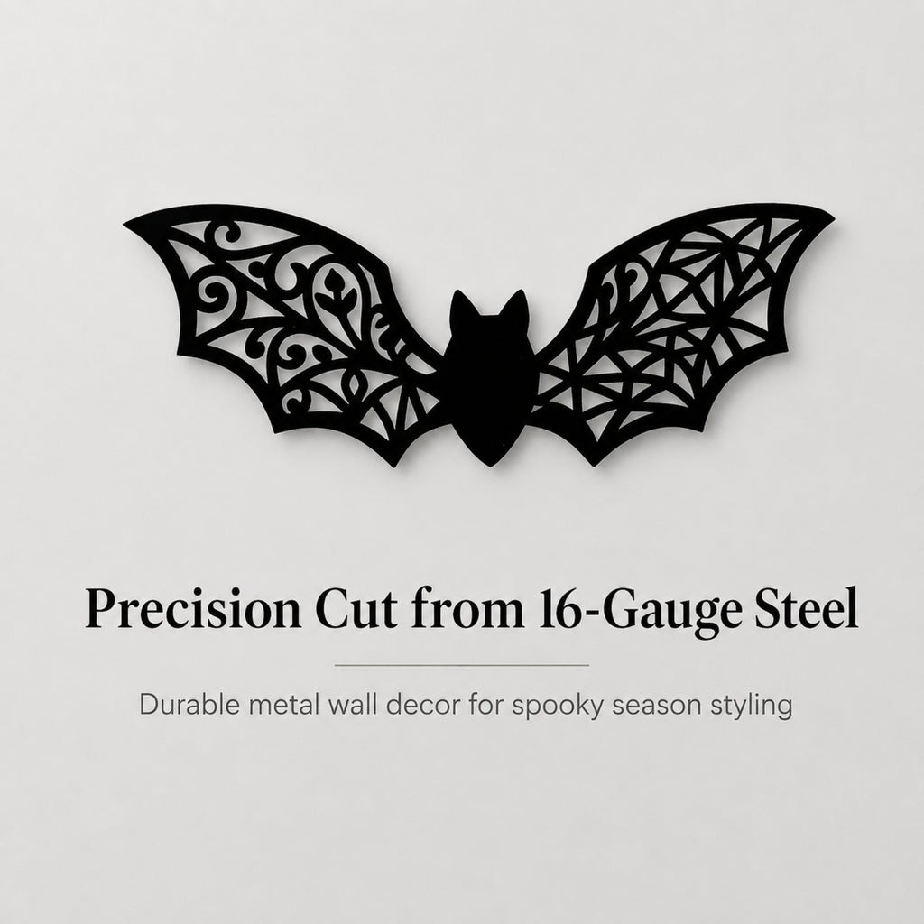 Black bat-shaped metal wall decor with intricate cutout patterns, shown on a light gray background with text reading 'Precision Cut from 16-Gauge Steel' and 'Durable metal wall decor for spooky season styling.'.
