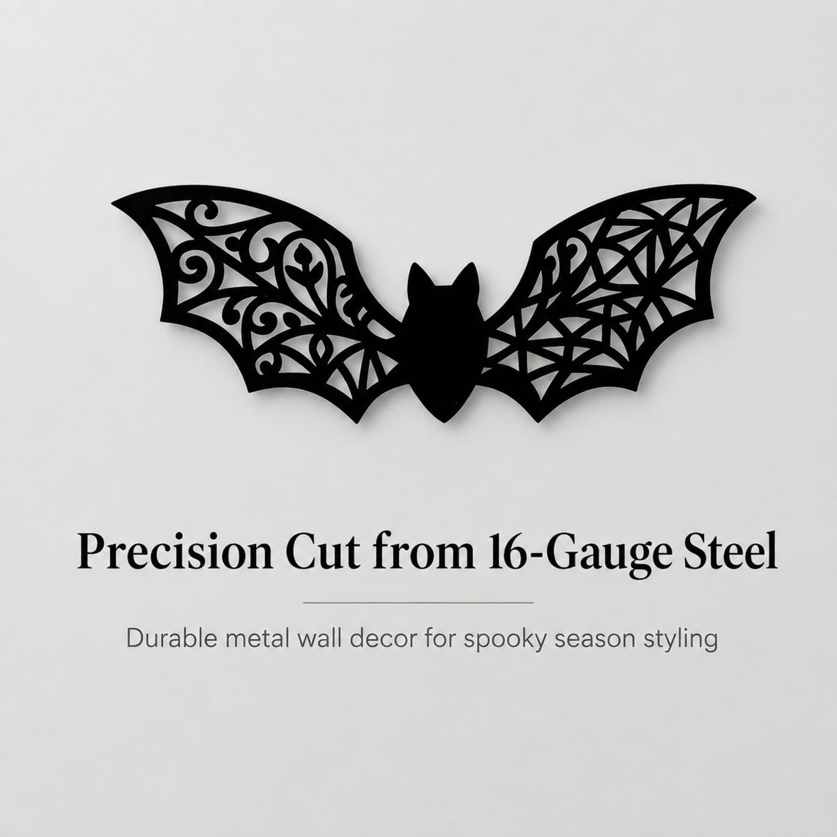 Black bat-shaped metal wall decor with intricate cutout patterns, shown on a light gray background with text reading 'Precision Cut from 16-Gauge Steel' and 'Durable metal wall decor for spooky season styling.'.