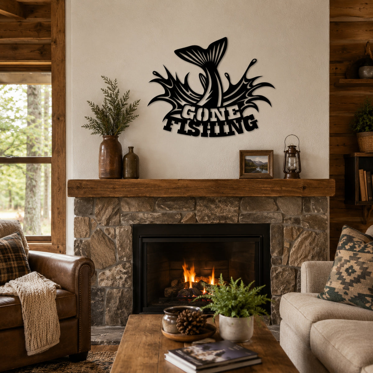Black metal wall art featuring a fish tail and the words 'GONE FISHING' in a rustic cabin living room above a stone fireplace.